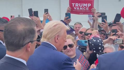 Trump greets supporters in Michigan