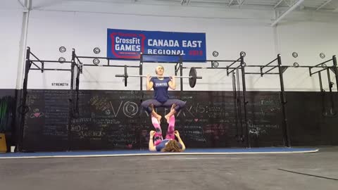 Girls Do Yoga Stunt While Lifting Weights