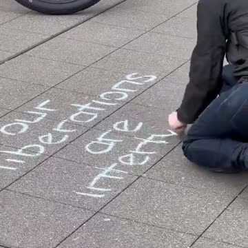An extremist writes an anti-police sign