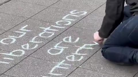 An extremist writes an anti-police sign