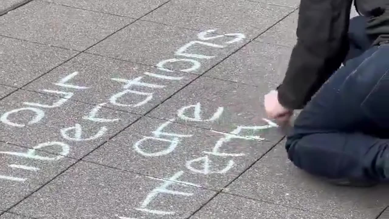 An extremist writes an anti-police sign