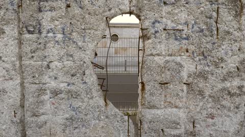 Looking Through a Hole in Berlin Wall