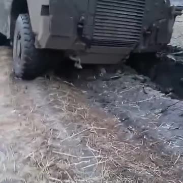 R-rasputitsa. An Australian-made Ukrainian Bushmaster PMV armored vehicle stuck in the mud