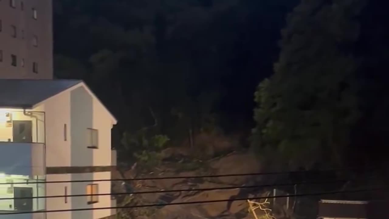 A landslide has engulfed a house near the Matsuyama Castle in Japan.
