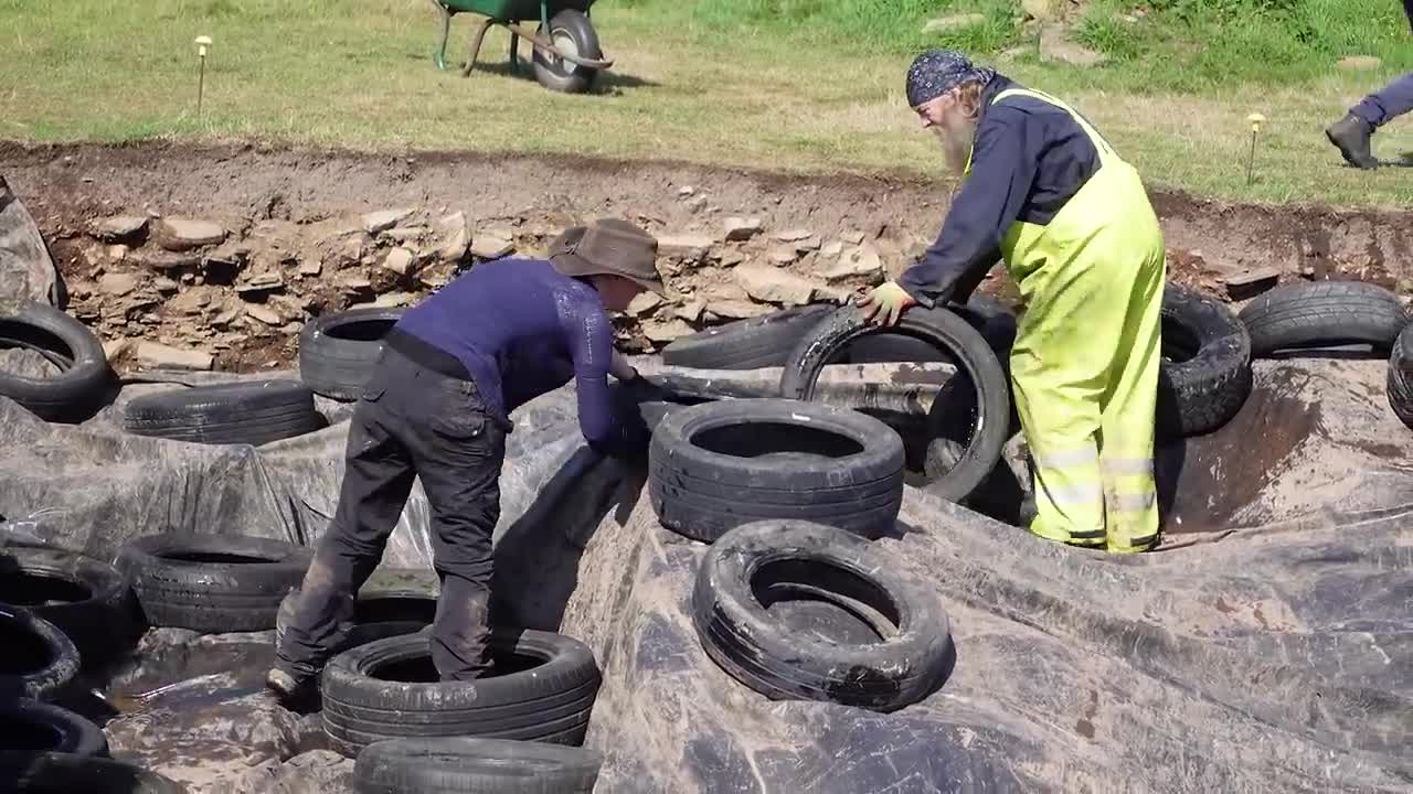 I helped cover a 5,000-year-old monument with worn-out tires