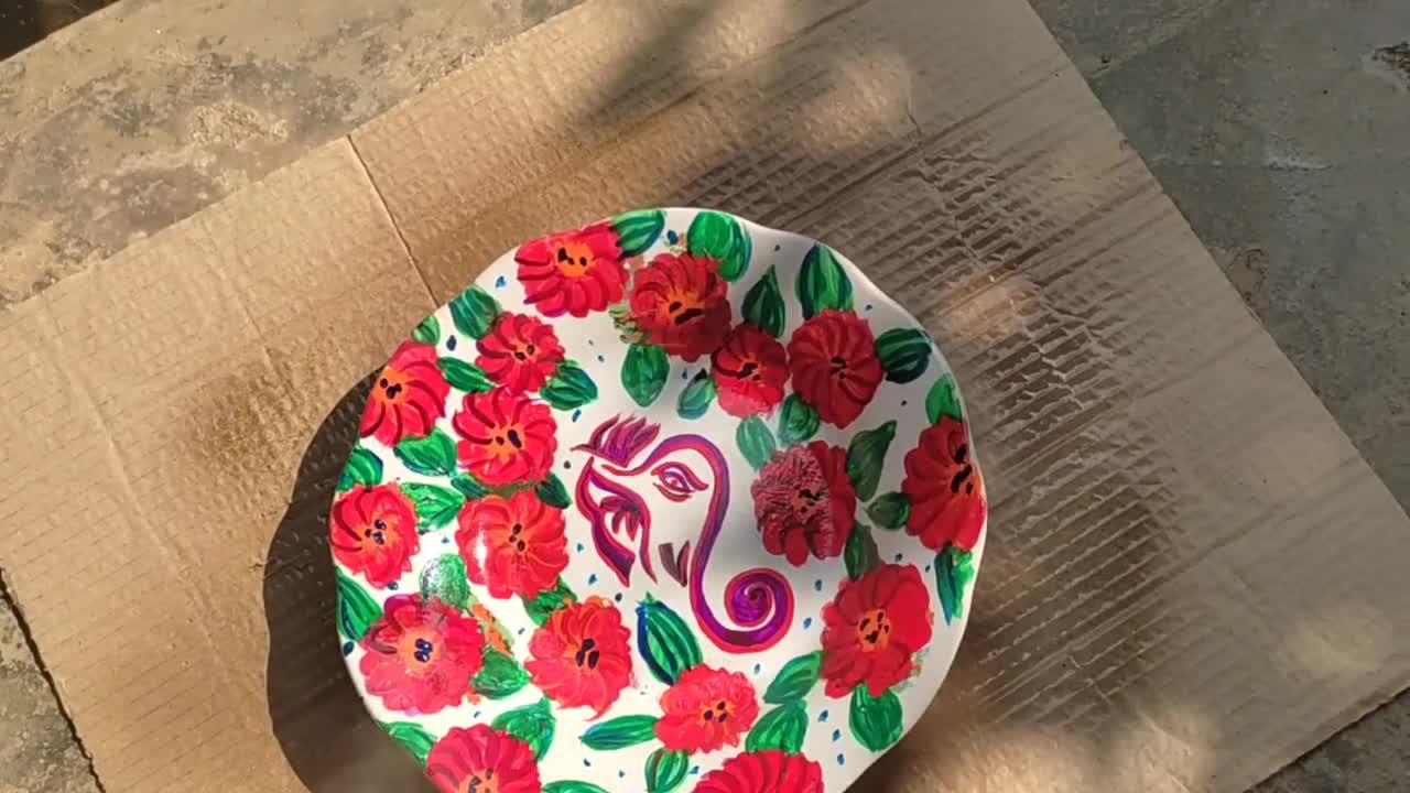 Doodled Lord Ganesh on a glass plate