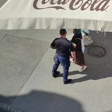 While the woman was distracting the Kiev regime's policeman, the Orthodox priest threw bread