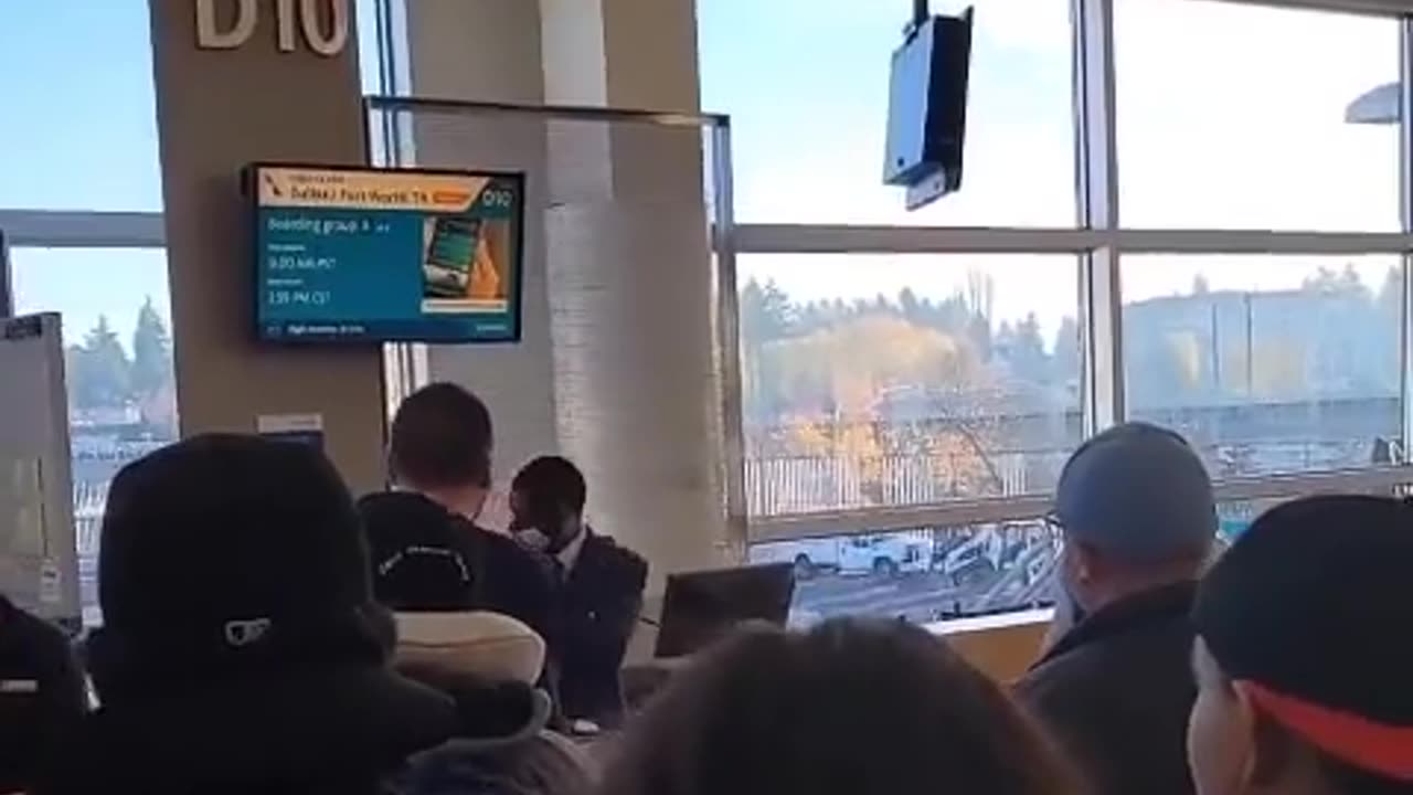 Man screaming “race war” while doing the Nazi salute at an airport in Seattle