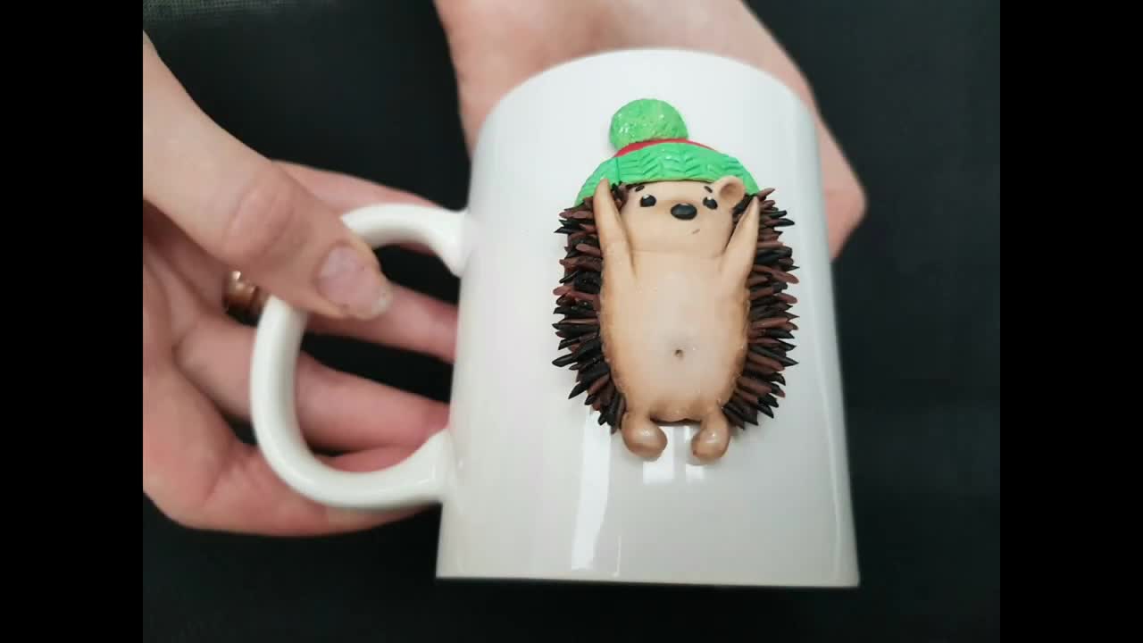 Cup with decor "Enthusiastic Hedgehog" from the "Funny Hedgehogs" collection. Mug with a hedgehog.