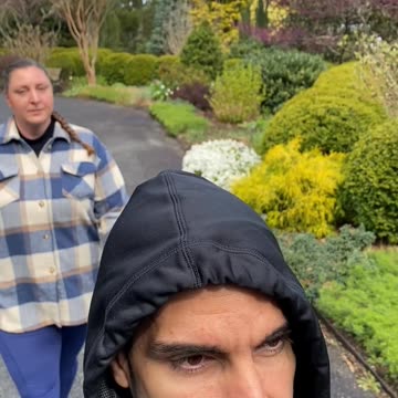 WALKING THROUGH BLOOMING FLOWERS