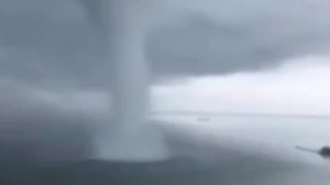 Close Call: Guy Narrowly Escapes Tornado's Fury!