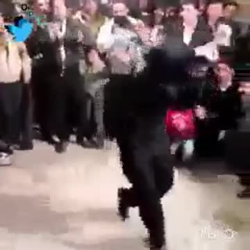 Men dance in a wedding party