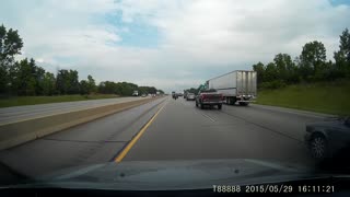 Rolling Tire Targets Car On Highway