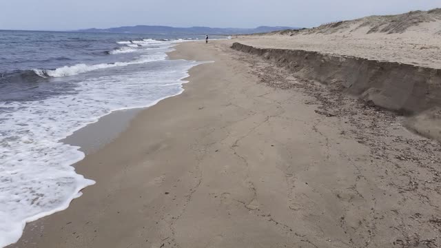 Walking on the shoreline - 2nd longest Italian beach