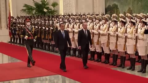 Chinese Premier Li meets German Chancellor Scholz in Beijing | AFP