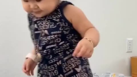 Little girl adorably dances to some techno beats