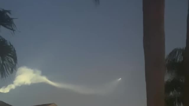 Rocket Leaving a Trail in the Sky and Forming Bubble and Oval Shapes