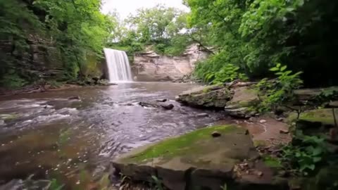 Distant waterfall with running river