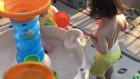 Mila and Aviv hanging out at the pool