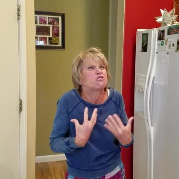 Senior Woman Makes Funny Faces While Eating Sour Warhead Candy