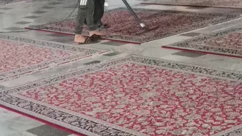 Cleaning the shrine of Imam Reza