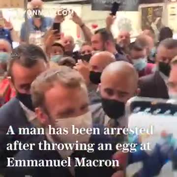 French president Emmanuel Macron egged by protester shouting "vive la revolution"