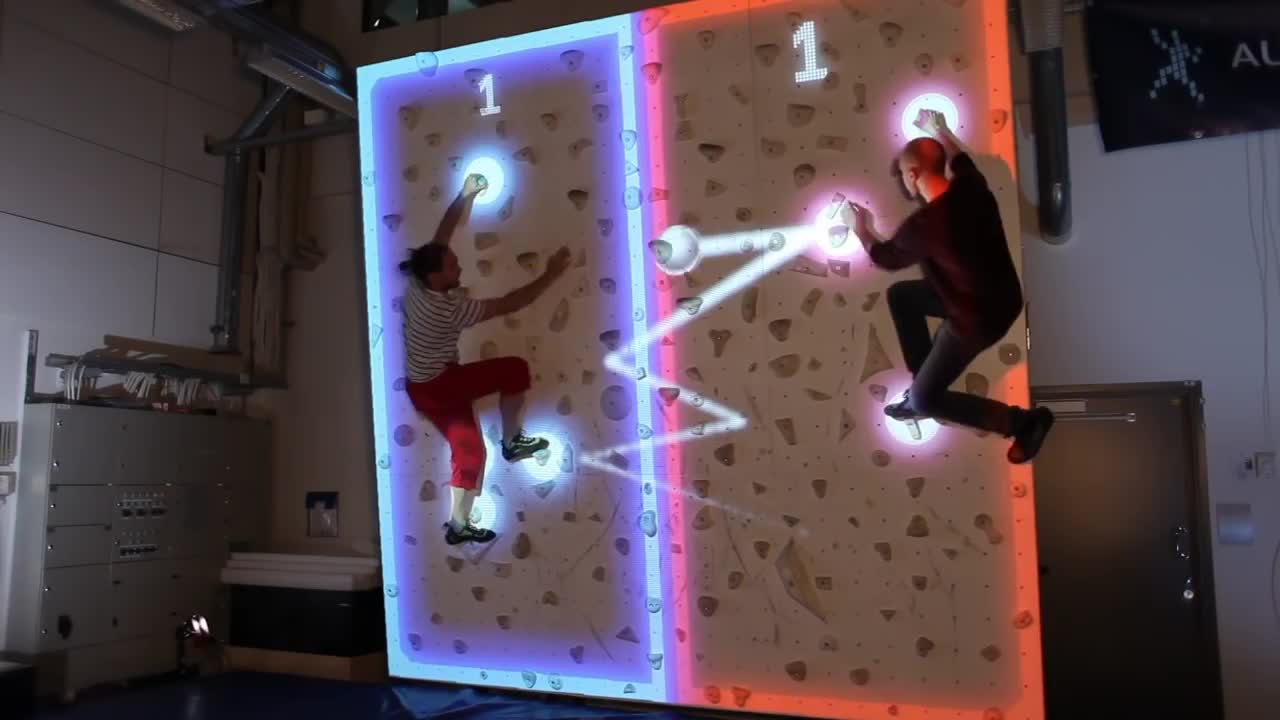 Futuristic augmented rock wall combines climbing with pong