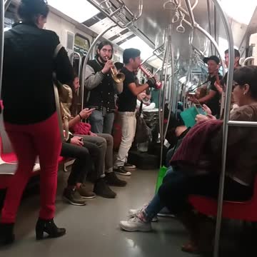 Band playing on subway train