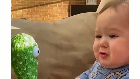 Adorable Baby Meets Dancing Cactus: Heartwarming Interaction 🌵👶💃