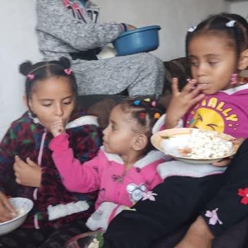 Cute kids eating corn