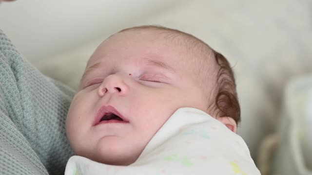 Mother Put Her Baby to Sleep