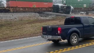 Stranded Truck Sliced in Two by Train