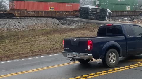Stranded Truck Sliced in Two by Train
