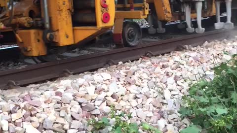 Machine correcting tracks of Indian Railways