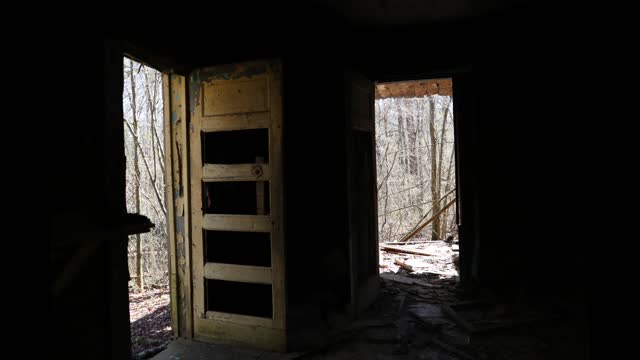 Old, abandoned house deep in the woods.