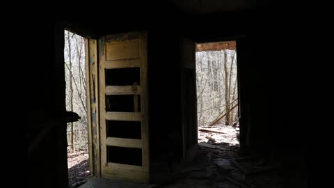 Old, abandoned house deep in the woods.