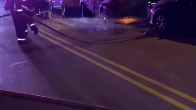 Fire Department Hoses Down Flaming Car