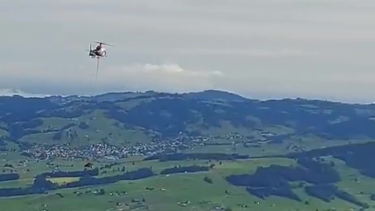 Cow taking a trip to the vet in Switzerland, from a mountaintop.😄