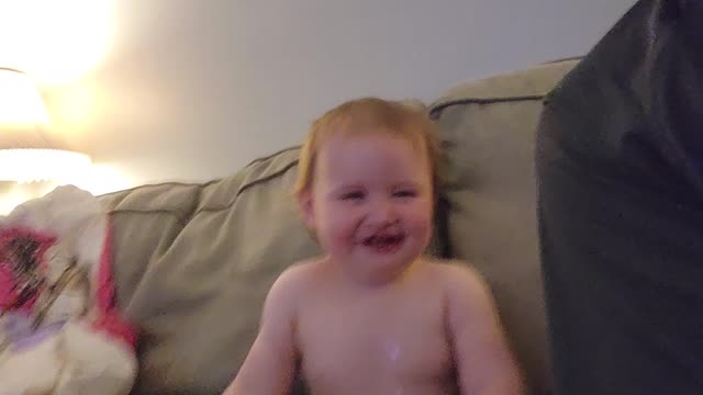 My daughter laughing.