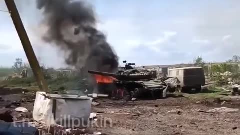 A Russian soldier films from a trench as artillery fire is incoming