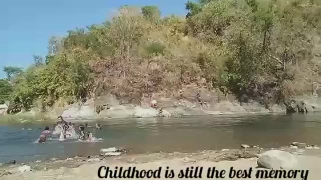 Father and Kids having Fun At the Riverbanks