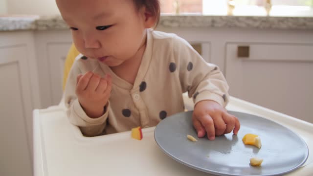 Messy baby adorably gets mini bath after meal time