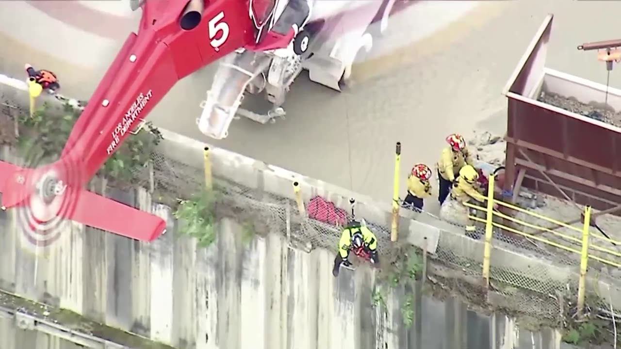 Watch dramatic rescue of man from raging river