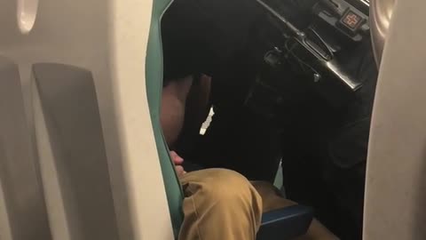 Police wake up sleeping guy on train to kick him off