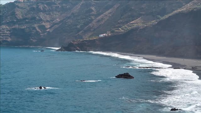 beach with black volcanic sand at nord coast of tenerife island canary islands atlantic ocean spain