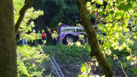 Dump truck head on crash with car with fatalities in river