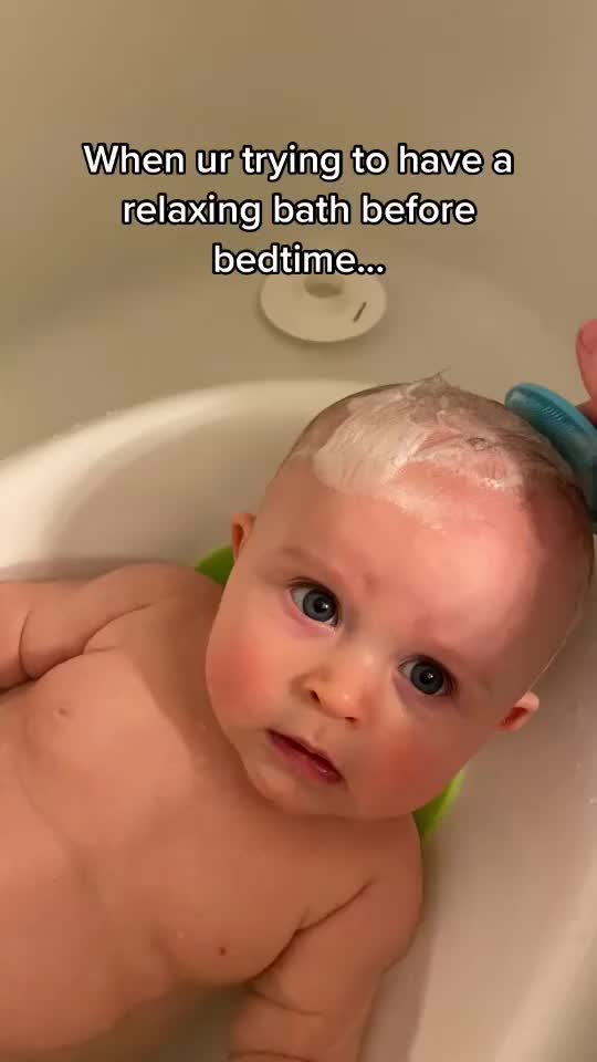 When your baby is trying to enjoy bathing but you sing terribly