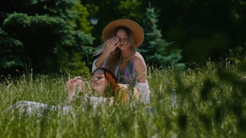 Women Relaxing Together in a Field