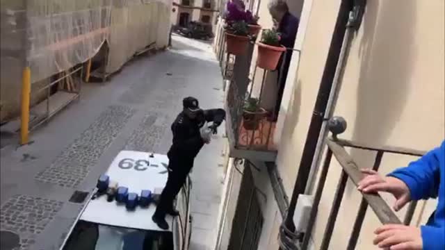 Spain Cop Hops On Car To Give Bday Gift To Isolated Nan