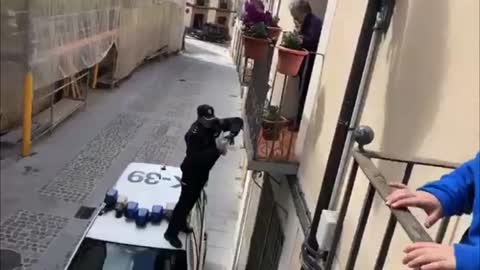 Spain Cop Hops On Car To Give Bday Gift To Isolated Nan